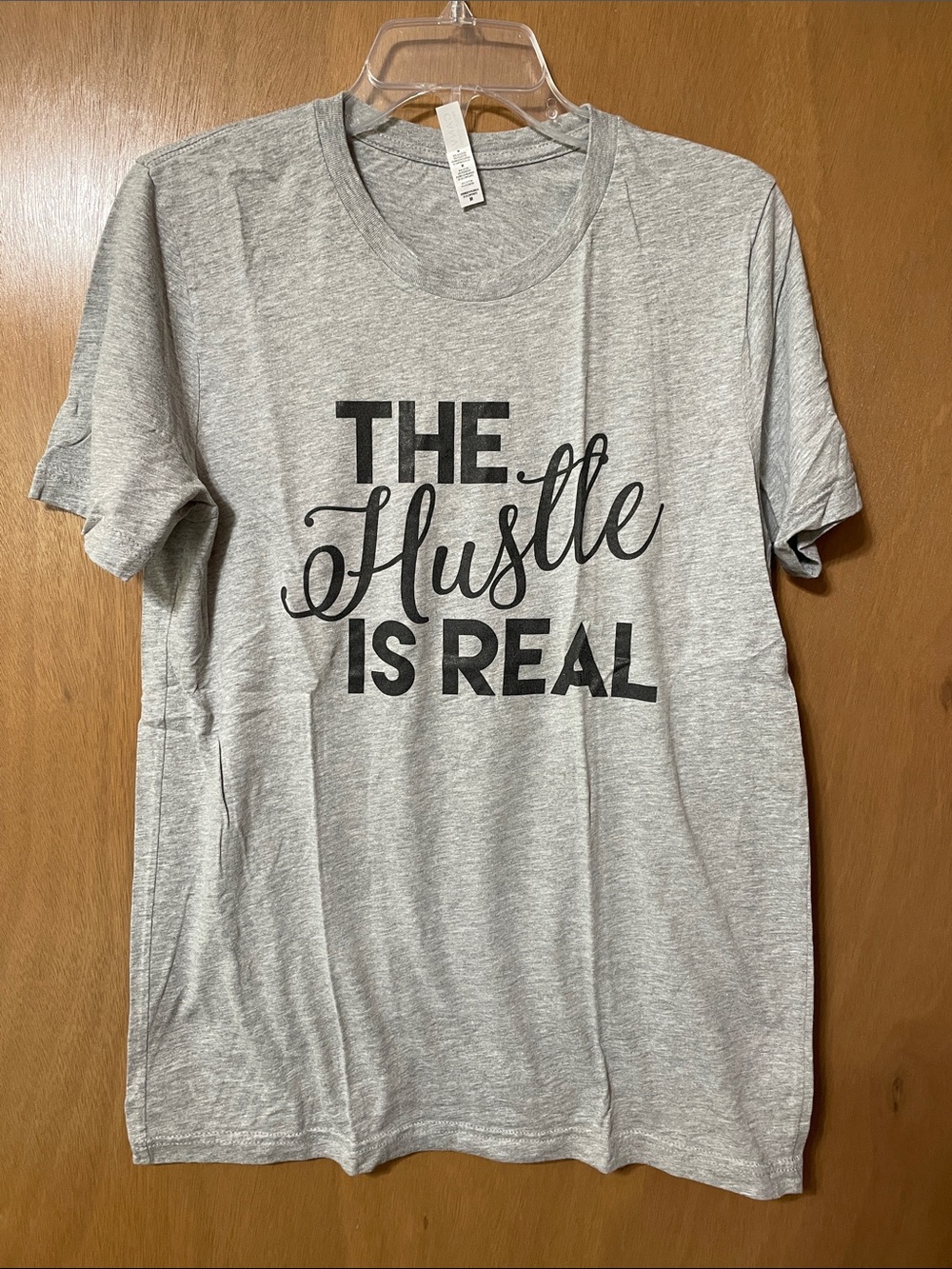 Bella Canvas Gray Short Sleeve Tee with "The Hustle Is Real" Graphic